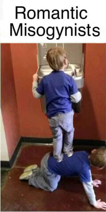 a boy standing on a water fountain