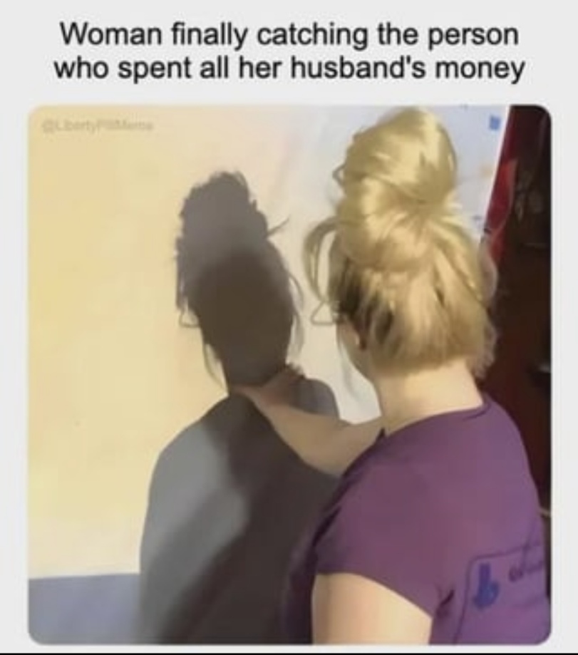 a woman looking at a shadow of a person