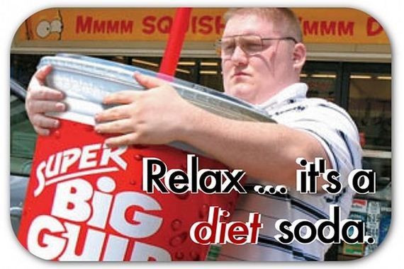 a man holding a large soda cup